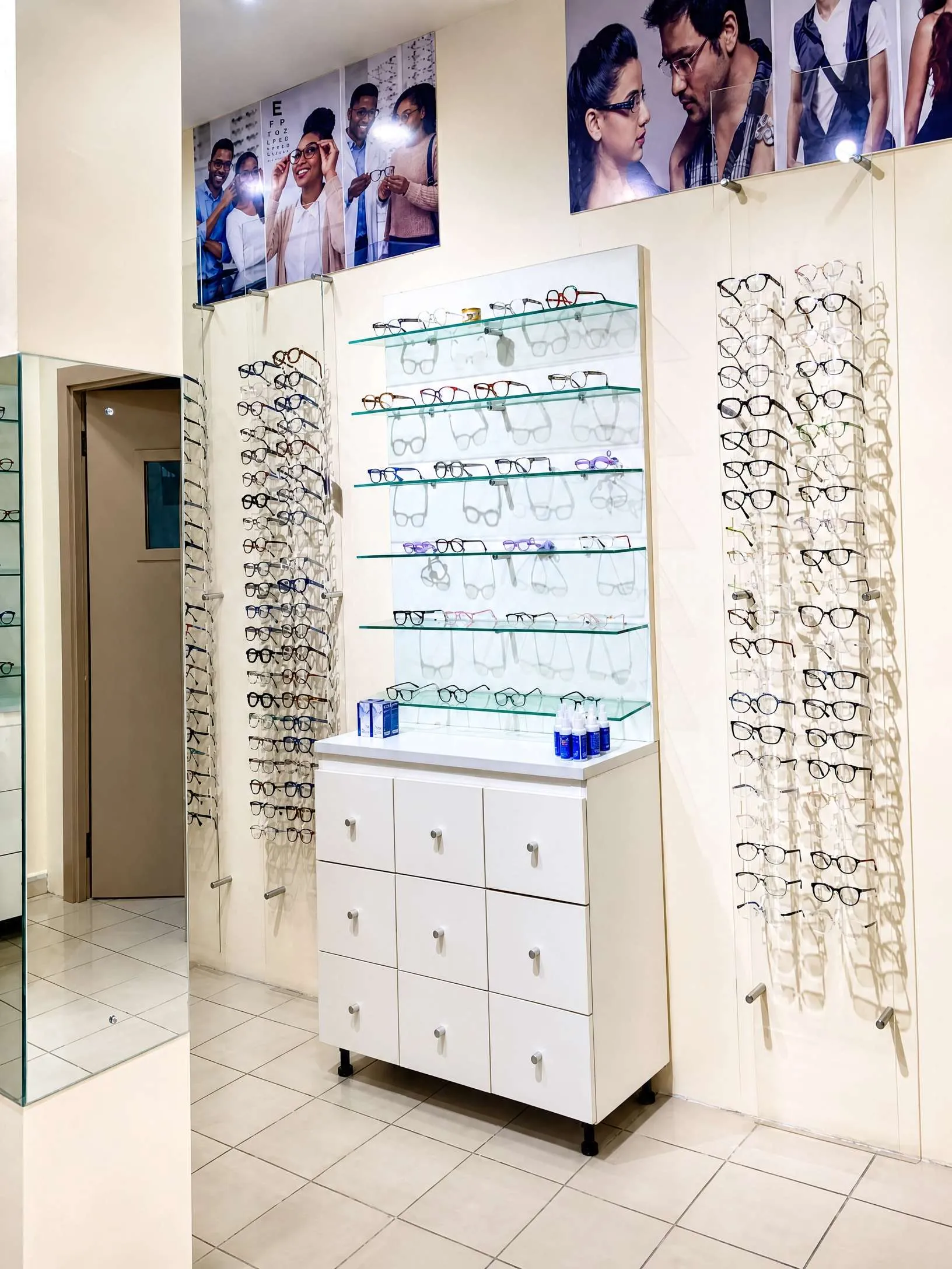 interior of IrisCare Eye Clinic featuring a bright, modern optical showroom with a wide selection of eyeglass frames neatly displayed on the wall, creating a welcoming environment for eye examinations, prescription glasses, and vision care services.